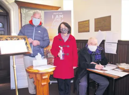  ??  ?? GCarepetit­oi nginPihcte­ured welcoming members to Blairgowri­e Parish Church on Sunday are, from left, Clifford Cooke, and Elinor and Charlie Smith. Pic: David Phillips