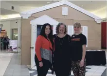  ?? KRIS DUBE SPECIAL TO THE WELLAND TRIBUNE ?? Arienne Good, from left, Elizabeth Zimmermann, and Franziska Emslie at Seaway Mall with the Cardboard House, a display that raises awareness about homelessne­ss.