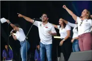  ?? NWA Democrat-Gazette/BEN GOFF • @NWABENGOFF ?? Hosts from Univision Arkansas call the Hogs during the Celebrando La Musica Presentado Por Wal-Mart.