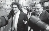  ?? John Minchillo Associated Press ?? FTX FOUNDER Sam Bankman-Fried, left, arrives at a federal courthouse in Manhattan on Feb. 16, 2023.