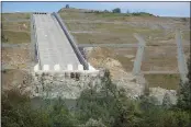  ??  ?? A one mile portion of the Brad Freeman Trail near the Oroville Dam spillway is closed this week as the Department of Water Resources conducts electrical work in the area. The main spillway is seen Monday in Oroville.