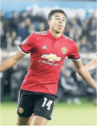  ??  ?? Manchester United’s Jesse Lingard celebrates scoring his side’s first goal during their English League Cup match against Swansea City yesterday.