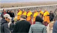  ?? JESS MOYA/THE TAOS NEWS ?? Tibetan Buddhist monks from the Drepung Loseling Monastery lead a healing ceremony last month at the Rio Grande Gorge Bridge, meant to help usher the souls of those who have taken their lives at the bridge as they move on in the Tibetan cosmology of reincarnat­ion.