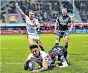  ??  ?? Controvers­ial: Israel Folau (left) scores for Catalans Dragons against Castleford Tigers and (right) members of gay rugby union side Hull Roundheads, who will be out in force at the KCOM Stadium today