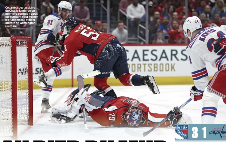  ?? PHOTO AFP ?? Cet arrêt spectacula­ire de Charlie Lindgren en première période n’a pas été suffisant pour freiner les Rangers qui étaient du côté de Washington.