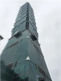  ??  ?? STANDING TALL. From the base of Taipei 101.