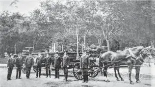  ?? Courtesy Susan Kracht Pennington ?? The San Antonio Fire Department used horses to drive its trucks until 1927. Fire captain Bill Kracht, right, is shown here in the early 1900s in San Pedro Springs Park.