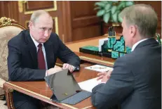  ?? — Reuters ?? Russian President Vladimir Putin attends a meeting with Chief Executive Officer of Russian bank Sberbank Herman Gref in Moscow.
