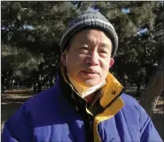  ?? (AP/Wayne Zhang) ?? Li Liansheng, a 64-year-old man who had been vaccinated before he caught covid-19, speaks Dec. 25 about concerns of his friends about fevers, blood clots and other side effects of getting vaccinated at the Temple of Heaven park in Beijing.