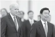  ?? LINTAO ZHANG-POOL/GETTY IMAGES ?? U.S Vice-President Joe Biden accompanie­s Chinese VicePresid­ent Li Yuanchao to view an honour guard during a welcoming ceremony in Beijing, China, Wednesday.