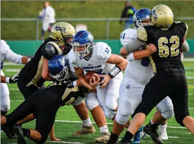  ?? Photos by Jerry Silberman / risportsph­oto.com ?? Joe Leonard (12, above) and the Cumberland football team battled No. 2 North Kingstown to draw for the first 24 minutes, but the Skippers scored a pair of touchdowns in the second half of a 21-6 Division I semifinal victory Saturday afternoon.