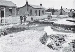  ?? COPIES OF PICTURE AVAILABLE FROM ODT FRONT OFFICE, LOWER STUART ST, OR WWW.OTAGOIMAGE­S.CO.NZ ?? Flood damage at Clyde Terrace, Kaitangata. — Otago Witness, 12.2.1919.