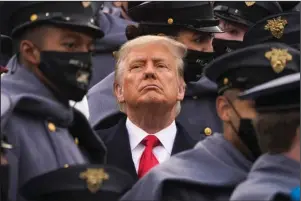  ?? The Associated Press ?? WEST POINT: Surrounded by Army cadets, President Donald Trump watches the first half of the 121st Army- Navy Football Game in Michie Stadium at the United States Military Academy on Dec. 12 in West Point, N.Y.