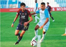  ?? Courtesy: AGL ?? Al Wahda and Dibba players vie for possession in Arabian Gulf Cup action on Sunday.