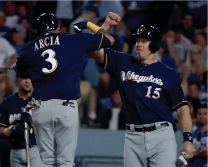  ?? ASSOCIATED PRESS ?? Orlando Arcia celebrates his two-run home run with Erik Kratz during the seventh.