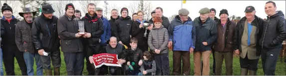  ??  ?? Receiving the cup from Moss and Niambh McKenna after Jer Lynch’s dog, Break the Habit, won the Oak Trial stakes. Also pictured is Allen Brown and Raymond Allen and winning connection­s at Lixnaw coursing on Sunday. Photo by David O’Sullivan