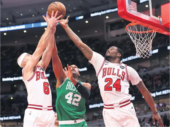  ?? MICHAEL REAVES/GETTY IMAGES ?? Ailing guard Alex Caruso (left) and injured forward Javonte Green (right) are probably the Bulls’ two most defensive-minded players.