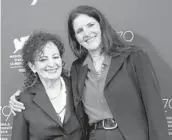  ?? VIANNEY LE CAER/INVISION ?? Nan Goldin, left, and director Laura Poitras are seen Sept. 3 at the Venice film festival in Italy.