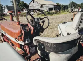  ??  ?? Not a bad place to work by 1965 standards. This was before air conditione­d cabs were the norm and farmers braved heat, cold, dirt and chaff.