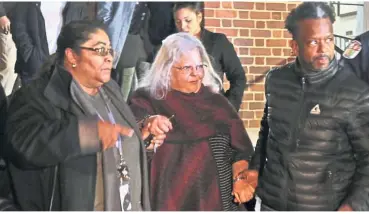  ?? — AP ?? Justice done: Susan Bro (centre), mother of Heyer, being escorted out of the courthouse by friends after the guilty verdict on Fields Jr.