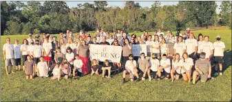  ?? COURTESY OF CYNDI MACALUSO ?? A group wearing BStrong T-shirts and gaiters gathers in Gilbertsvi­lle to show their support for Brendan Avvento, the Boyertown teen stricken by sudden cardiac arrest.