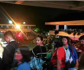  ?? —VINCENT CABREZA ?? Lines at transport terminals extended to downtown Baguio’s elevated walkways as residents and students wait for their ride home on Monday night. The city received an unusually high volume of visitors, many of them from Metro Manila, who took advantage...