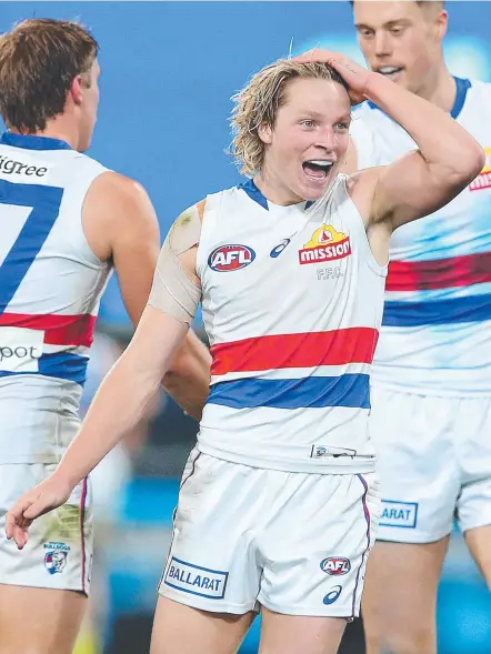  ??  ?? Cody Weightman of the Bulldogs celebrates a goal against the Brisbane Lions. Picture: AFL Photos/via Getty Images