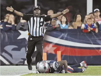  ?? STAFF PHOTO BY MATT STONE ?? PAINFUL LOSS: Cyrus Jones lays on the Gillette Stadium turf Thursday night after suffering a torn ACL and meniscus, which was confirmed by an MRI yesterday.