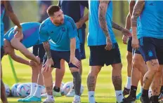  ?? AFP ?? ■ Argentina’s forward Lionel Messi and teammates during a training session at the Qatar University Training Site in Doha.