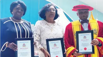  ?? ?? Representa­tive of former President Goodluck Jonathan and erstwhile Deputy Governor of Osun State, Erelu Olusola Obada ( left); Daughter and representa­tive of former Liberian Ambassador to Cote D’ivoire, Willye Mai Tolbert King and Nebolisa Arah, while receiving honorary awards at Bowen University’s 17th Convocatio­n recently.