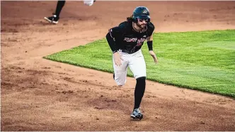  ?? ROBERTO E. ROSALES/JOURNAL ?? Isotopes left fielder Ryan Vilade rounds second base against the Sugar Land Skeeters Friday night at Isotopes Park. He went 1-for-3 with a run scored in a 10-3 loss.