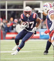  ?? Winslow Townson / Associated Press ?? The New England Patriots’ Damien Harris runs against the Buffalo Bills on Dec. 26.