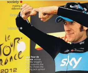  ??  ?? making a difference 2012 Tour de France winner Bradley Wiggins who supports the charity shows the Joining Jack symbol