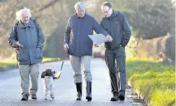  ??  ?? > MP Andrew Mitchell, centre, visiting the area