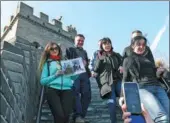  ?? WANG ZHUANGFEI / CHINA DAILY ?? Foreign civil servants, who are taking a course at the Chinese Academy of Governance, visit the Juyongguan section of the Great Wall in Beijing on Wednesday.