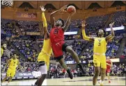  ?? ASSOCIATED PRESS FILE PHOTO ?? Austin Peay guard Terry Taylor (21) drives to the basket as West Virginia forward Derek Culver, behind, and West Virginia forward Gabe Osabuohien (3) defend during the first half of a game in Morgantown, W.Va.