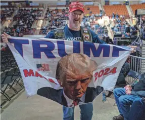  ?? SPENCER PLATT/GETTY IMAGES ?? Supporters of former President Donald Trump wait to hear him speak at an NRA forum on Friday in Harrisburg, Pa.