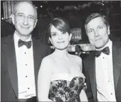  ?? Alberto Rodriguez NBC ?? BRIAN ROBERTS, left, actress Tina Fey and Steve Burke at the 2013 Golden Globes.