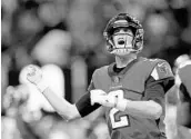  ?? KEVIN C. COX/GETTY IMAGES ?? Falcons QB Matt Ryan, who passed for 272 yards, celebrates after scoring the second of his 2 rushing TDs.