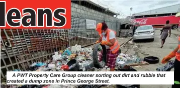  ?? ?? A PWT Property Care Group cleaner sorting out dirt and rubble that created a dump zone in Prince George Street.