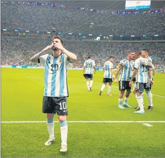  ?? AP ?? Argentina forward Lionel Messi celebrates after scoring the opening goal against Mexico at Lusail Stadium on Saturday.