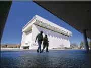  ?? RALPH BARRERA / AMERICAN-STATESMAN ?? Steve and Diane Sliwinski of Michigan, who were visiting relatives in the area, leave the LBJ Library on Monday after being turned away.