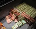  ??  ?? The evidence Police seized gambling parapherna­lia, 11 firearms and $1 million in cash. Wei Wei later alleged that some evidence might have been planted by police