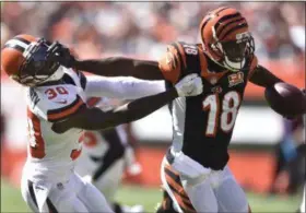  ?? DAVID RICHARD — THE ASSOCIATED PRESS ?? Bengals wide receiver A.J. Green blocks Browns defensive back Jason McCourty in the first half Oct. 1 at FirstEnerg­y Stadium.