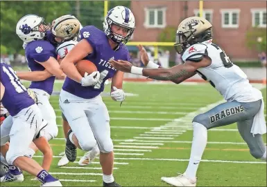  ?? Steven Eckhoff ?? Darlington’s Kolin Rogers (left) tries to avoid Pepperell’s Marsyan Griffin as he runs the ball during the first quarter of Friday’s game at Chris Hunter Stadium. Rogers scored on the play as Darlington went on to win 17-7.