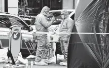  ?? Alberto Pezzali / Associated Press ?? Forensics work takes place Saturday at the scene of the London Bridge stabbings. The attacker, Usman Khan, was convicted in 2012 of terrorism offenses and released from prison last year.