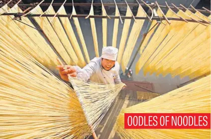 ?? Picture: Reuters ?? A villager hangs hand-made noodles up to dry in Linyi, Shandong province, China, yesterday.