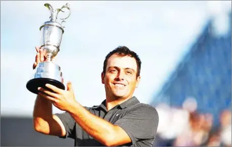  ?? AFP ?? Francesco Molinari poses for photos with the Claret Jug after winning the 147th Open Championsh­ip at Carnoustie on Sunday.