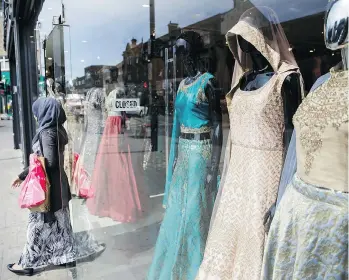  ?? TIM IRELAND/THE ASSOCIATED PRESS ?? Covered-up chic is slowly making its way into mainstream fashion. From exclusive designers to fast-fashion chains, retailers are trying to court millions of Arab consumers.