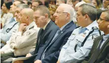  ?? (Marc Neiman/GPO) ?? PRESIDENT REUVEN RIVLIN sits between Public Security Minister Gilad Erdan (left) and Police Commission­er Insp.-Gen. Roni Alsheich at a ceremony held at the President’s Residence in Jerusalem on Wednesday.